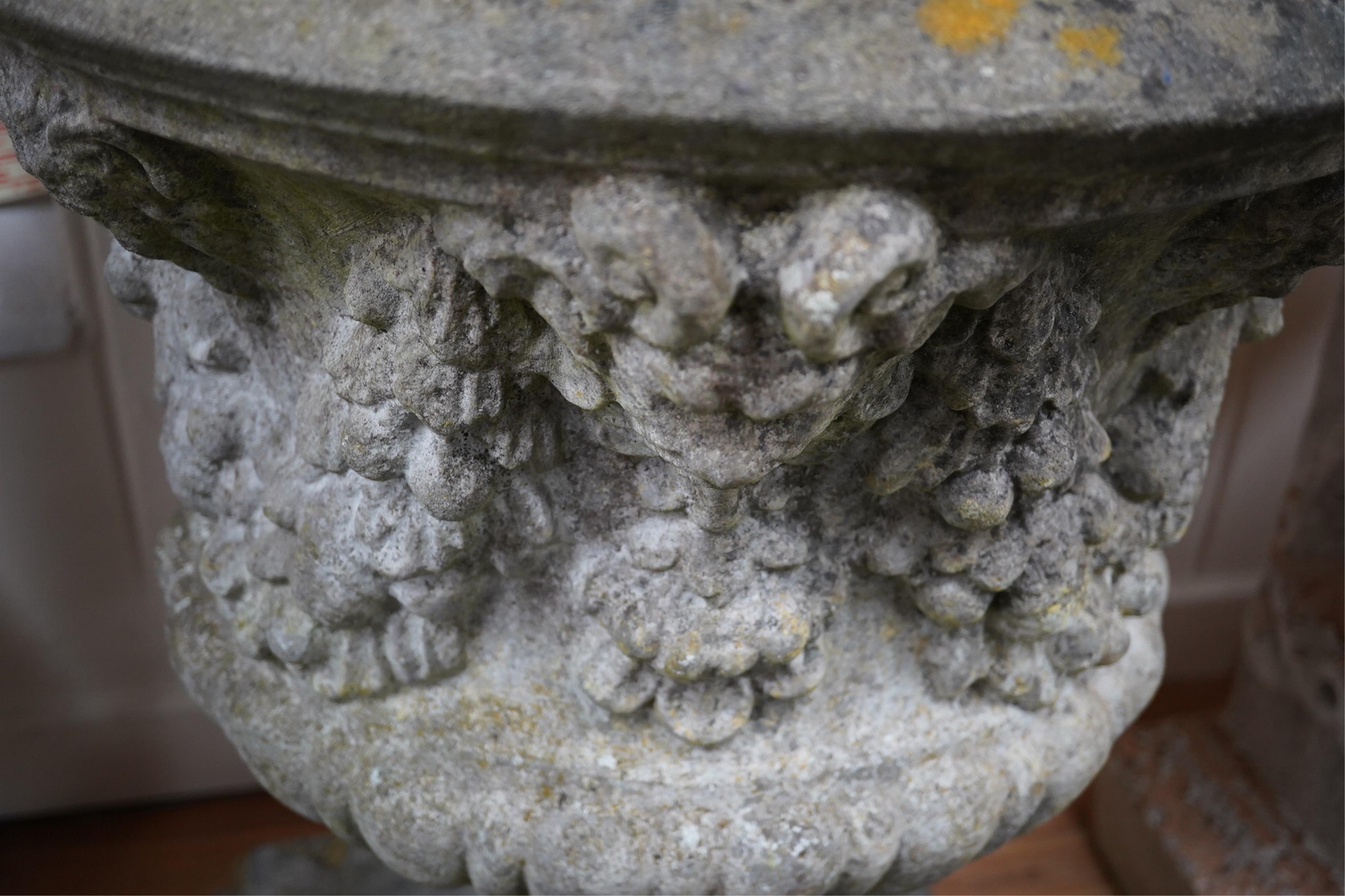 Three reconstituted stone campana shaped garden urns